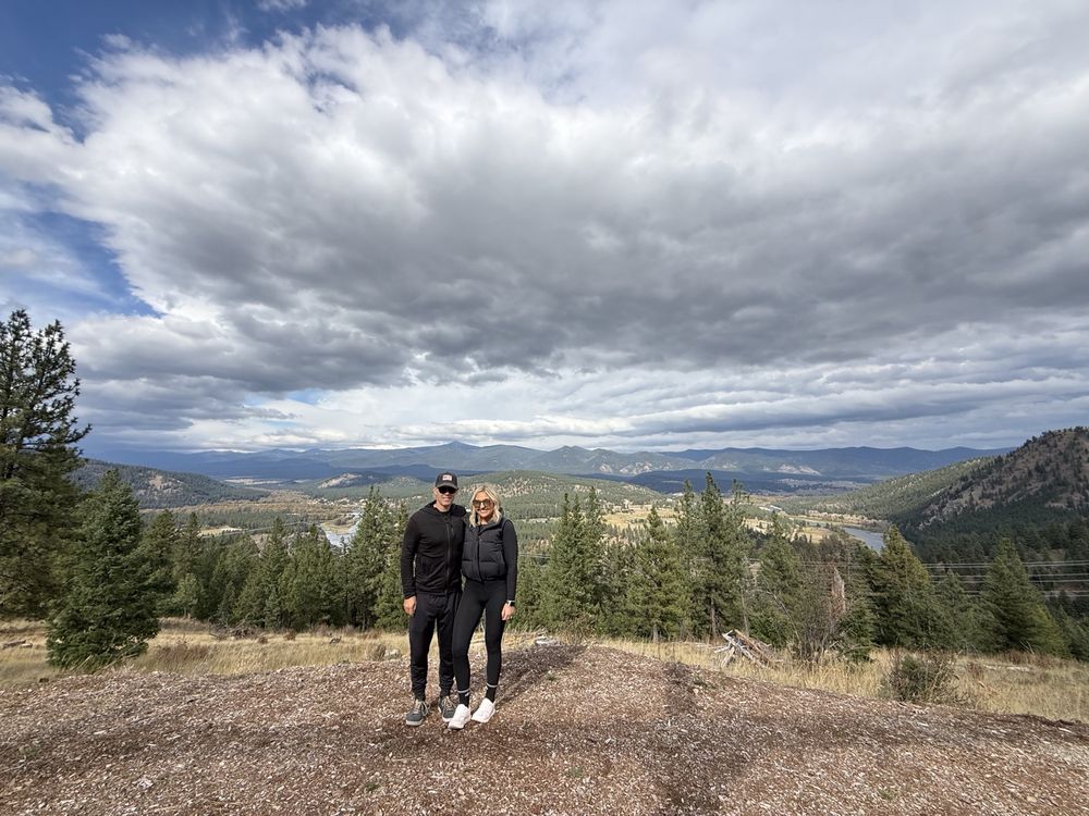 Adele and her husband at a mountain overlook